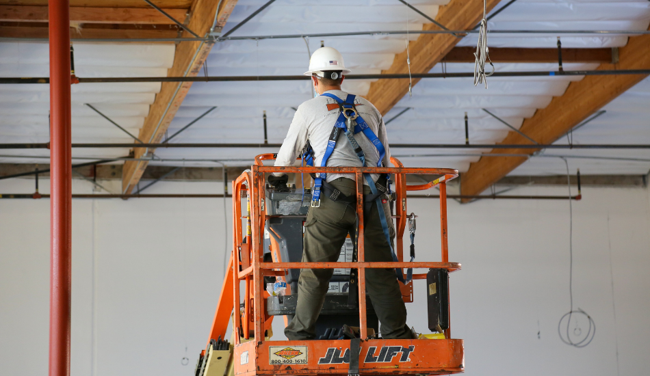 Prime Employee on Lift with Harness